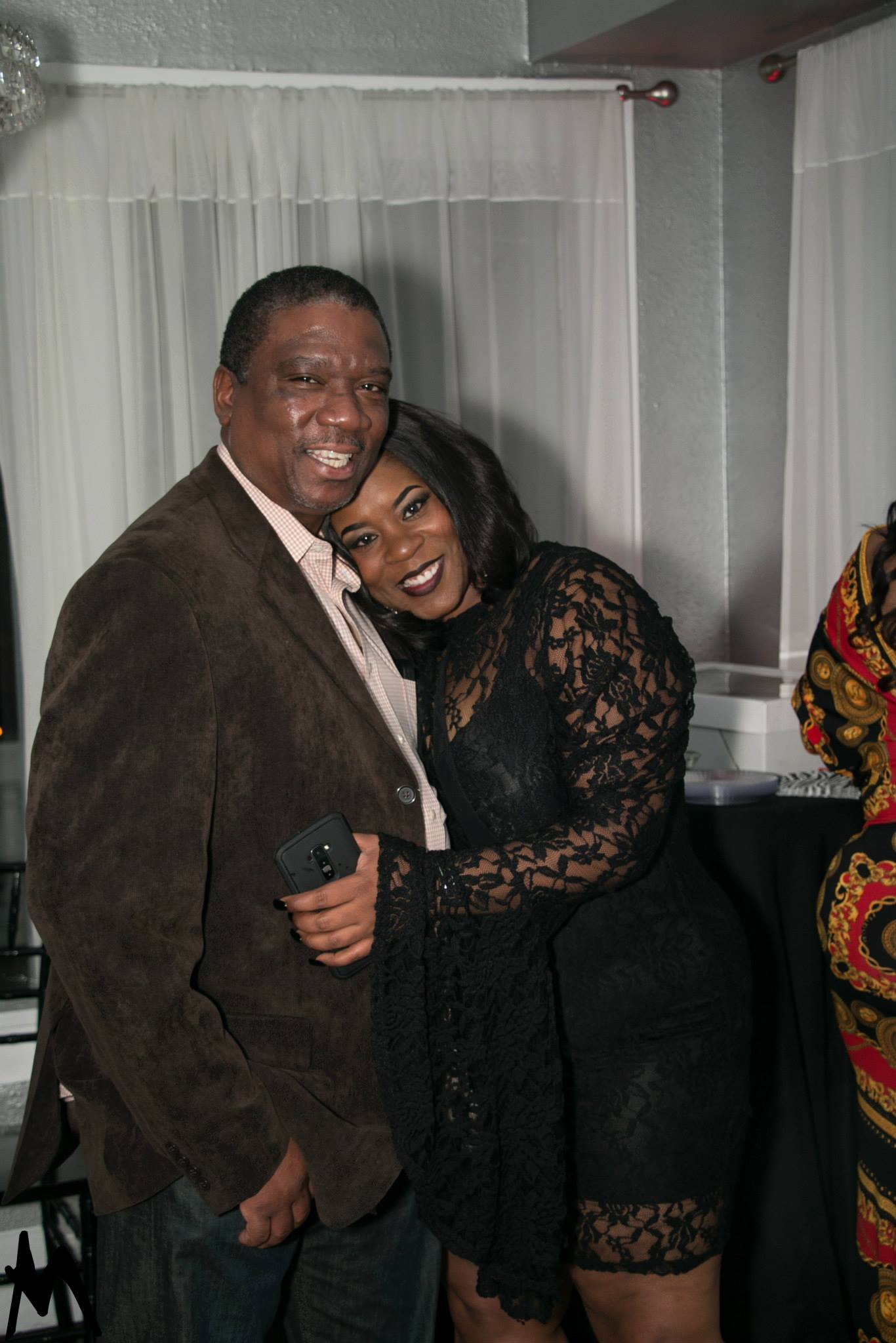Two guests smiling together at a Twyn Sol event