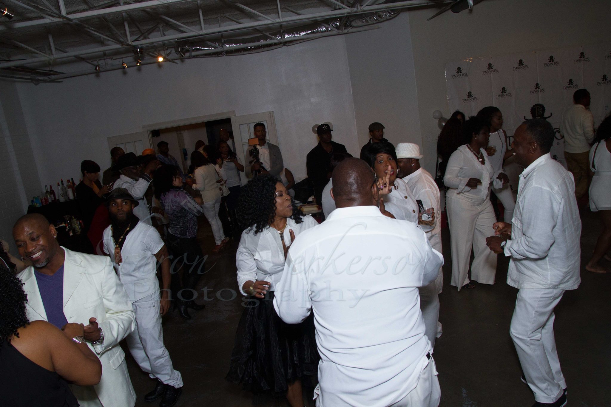 Guests dancing together during a Twyn Sol celebration