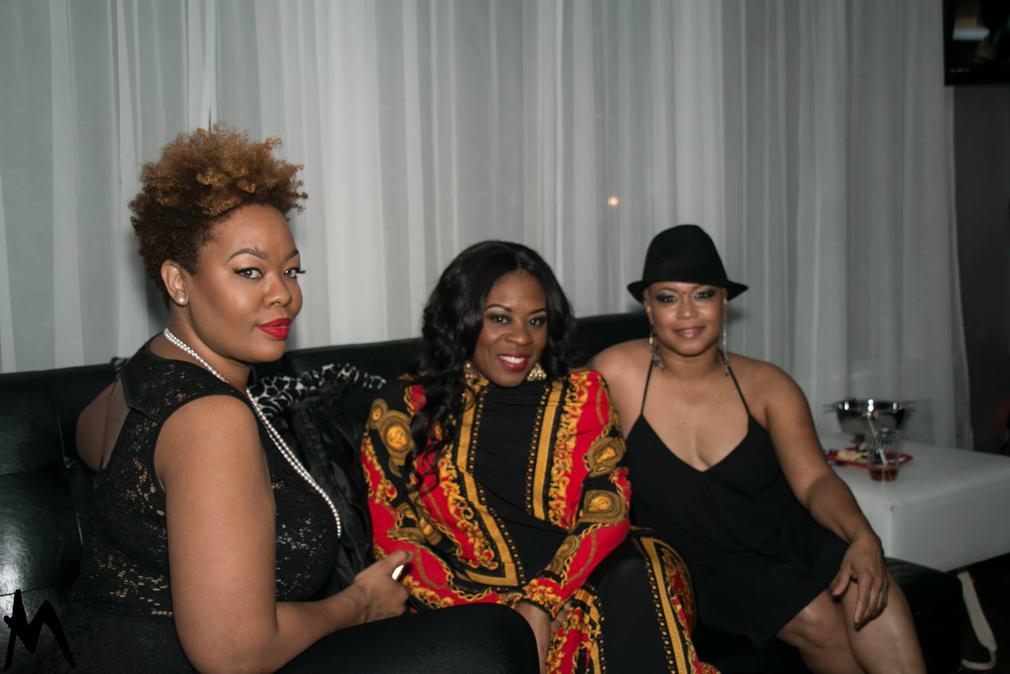 Three guests relaxing together during a Twyn Sol event