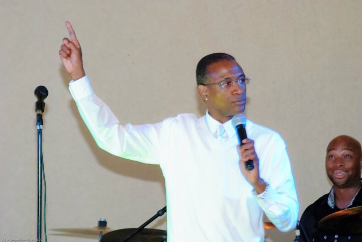 Speaker addressing the audience with a microphone