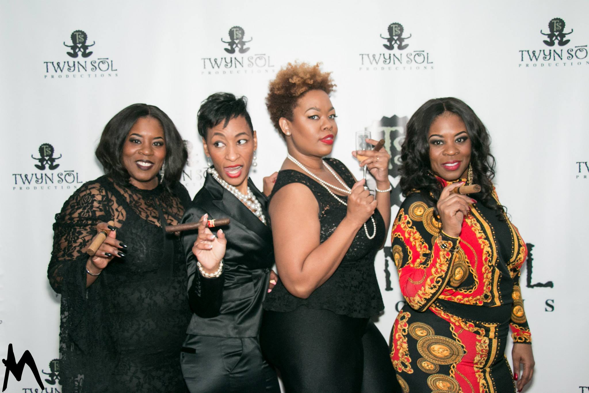 Guests celebrating at the Twyn Sol backdrop